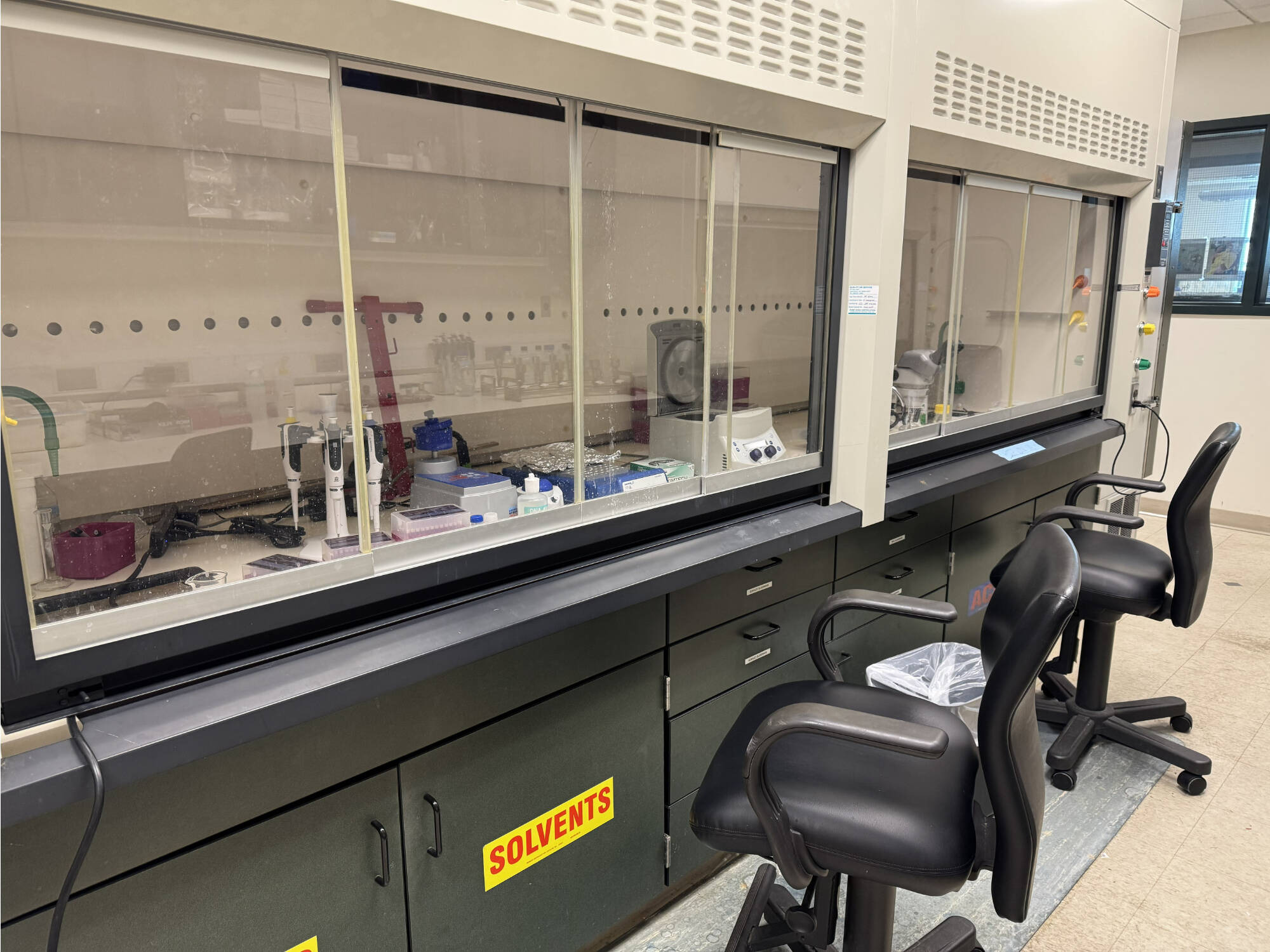 A genetics workspace set up inside of a fume hood.